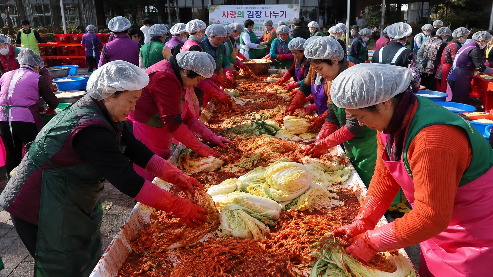 A community gathering to make large batches of kimchi together during kimjang season